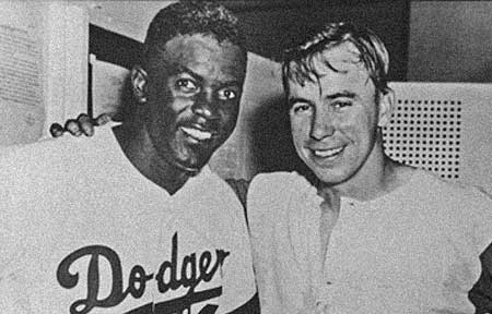Dodger greats Jackie Robinson and Pee Wee Reese - when fans booed Robinson, Reese put his arm around him in an expression of Brotherhood. That small but significant gesture resounds to this day. Click Here To Learn More About Pee Wee Reese and his symbolic contribution to breaking down the racial barriers in Baseball.