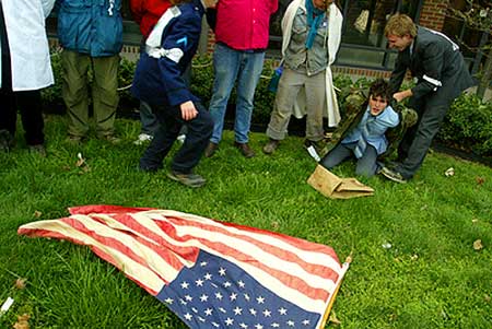 Jeremy John, right, laughs as he acts in an anti-Patriot Act II political theatre with Erik Woodworth outside the Bloomington office of the FBI.